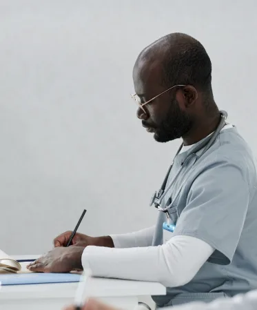 A doctor writing reports